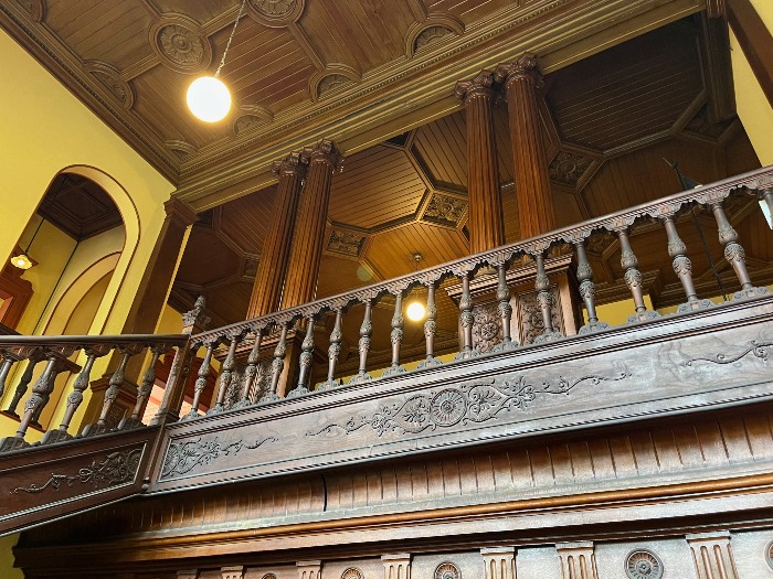Ornate stairway railing and ceiling