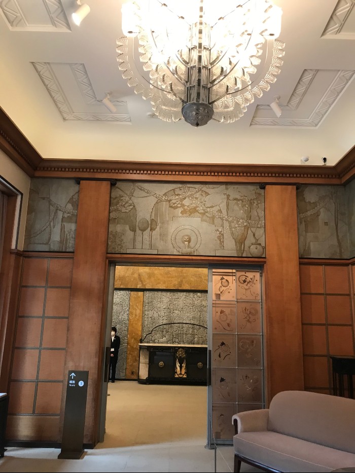 Guest room entry to dining room with chandelier by Lalique