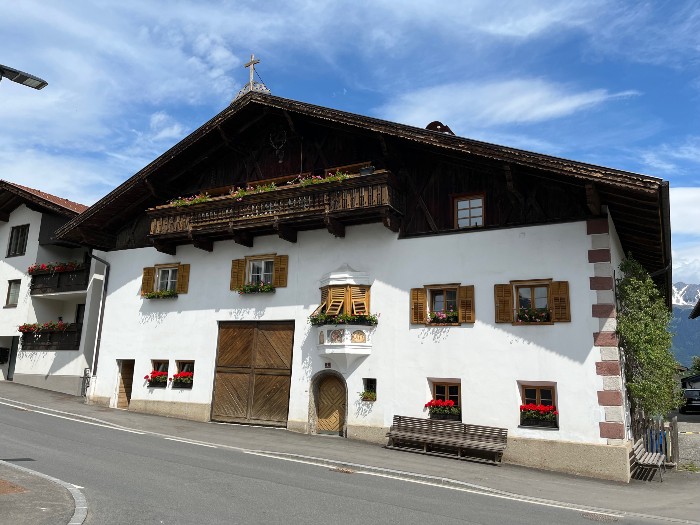 A sample of a house in Mutters. Notice that many homes have some religious symbol displayed.